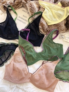 Detailed close-up of colorful French style mesh bras with exquisite contrast straps