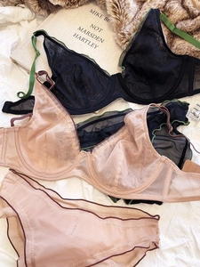 Flat lay of French style lace mesh lingerie sets with elegant scallop embroidery detail
