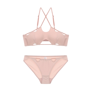 Detail of dusty pink lingerie set featuring halter neck and lace-up cutout design
