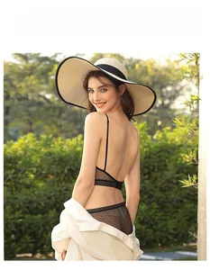 Detail of French style black polka dot mesh lingerie set with backless U-shape design