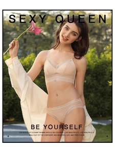 Detailed close-up of beige mesh lingerie set with polka dots and striped elastic bands