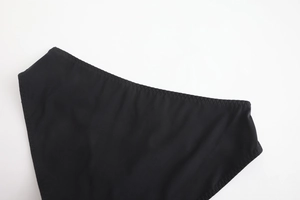Detail of zig-zag stitching on high-elastic black mesh lace panties with seamless edges