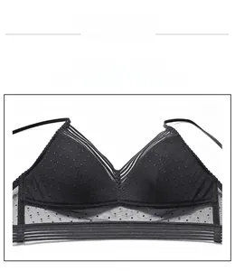Detailed close-up of black floral lace bra with sheer mesh and strap accents