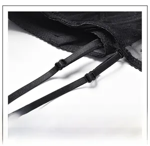 Close-up of adjustable thin straps and metal buckles on black mesh lingerie