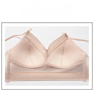Detail of nude wireless bra showing breathable dotted mesh fabric and thin elastic straps