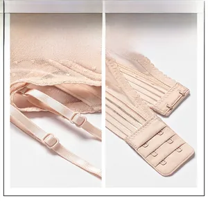 Detail view of adjustable thin straps and two-row hook closure on sheer mesh bra