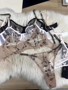 Close-up of sheer floral lace embroidery on french style underwire lingerie sets
