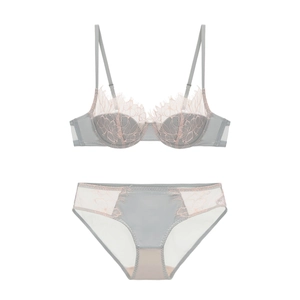 Detail of grey-blue French lace lingerie set with eyelash trim and floral embroidery