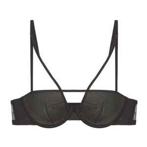 Detailed view of sheer black mesh bra with cross-strap design and underwire support