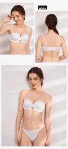 Detail of white seamless half-cup bra with detachable straps and silky breathable fabric