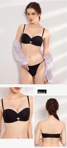 Detail view of black strapless push-up bra and seamless panties set with metal connector