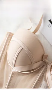 Macro detail of beige push-up bra featuring soft underwire support and sheer mesh lace fabric