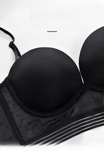 Close-up of smooth black U-shaped seamless bra with sheer mesh and stripe details