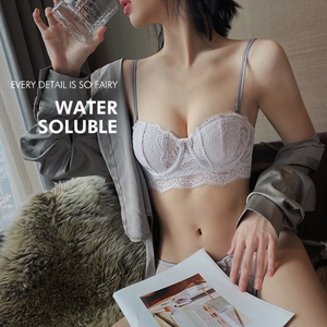 Detailed view of lavender water soluble lace half-cup bra with eyelash lace edges