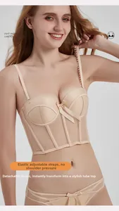 French beige corset bra detail with adjustable detachable straps and lace mesh texture