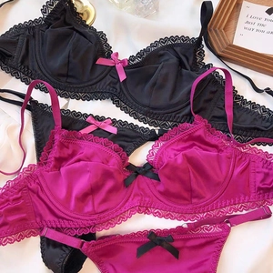 Elegant satin and lace lingerie set in black and rose red with heart embroidery