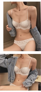 Close-up of elegant white floral lace bra set with delicate scalloped edges and fine embroidery