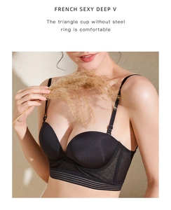 Detail of seamless black deep V-neck bra with breathable mesh wings and elastic band