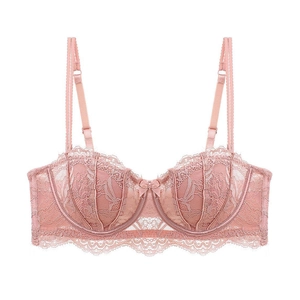 Detail of dusty pink lace bra with half cups, eyelash lace patterns and bow accent