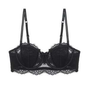 Detail of black eyelash lace demi cup bra with delicate bow and sheer floral embroidery