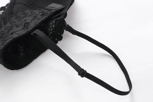 Close-up of black floral lace embroidery and adjustable elastic strap on French style bra