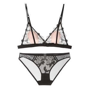 Detailed view of French lace bra set with black rose embroidery and sheer mesh texture