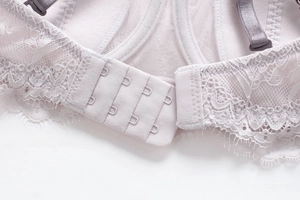 Detail view of the secure three-row hook-and-eye back closure on this lace bra