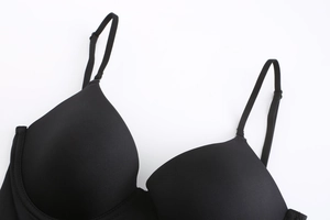 Close-up of seamless black French style bra with adjustable straps and smooth texture
