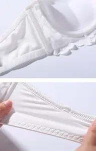 Detailed view of elastic lace wings on white bra showing soft texture and flexibility