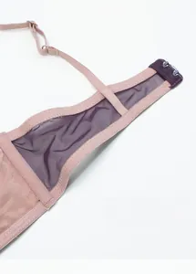 Close-up of three-row back hooks and breathable double-layer mesh wings on bra