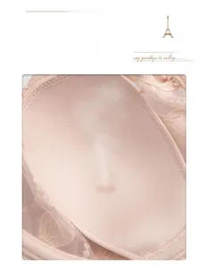 Detailed macro view of breathable rabbit-ear shaped cup lining with delicate lace trim