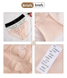 Detail view of French embroidered lace bra set with cotton lining and mesh bow patterns