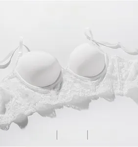 Detail showing white lace bra with smooth cups and adjustable straps for a minimalist look