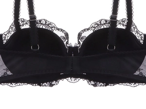 Detail of black lace bra back featuring adjustable straps and exquisite floral embroidery