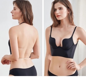 Detail of backless black deep U-neck bra with transparent straps for open back dresses