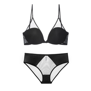 Detail of black seamless lingerie set with U-back design and transparent mesh inserts
