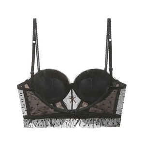 Close-up of black lace mesh bra featuring polka dots, padded cups and bow detail