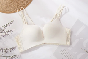 Detail of seamless wireless bra with lace trim and delicate double shoulder straps