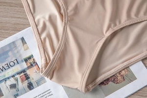 Detail shot of nude elastic fabric and fine stitching on a seamless women's underwear