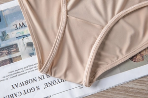 Detailed close-up of seamless nude panties with premium stitching on soft elastic fabric