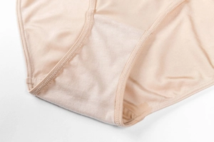 Macro shot of breathable double-layer cotton crotch on nude seamless briefs