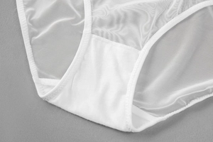 Detail of white mesh panty with pure cotton inner crotch and flat stitched edges