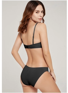 Detail of a black seamless push-up lingerie set with thin straps and smooth finish