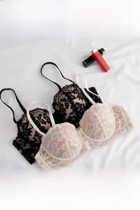 Detail shot of French lace 1/2 cup push-up bra showing fine embroidery and soft structure