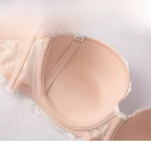 Detail of push-up lace bra cup with soft underwire and adjustable strap connection