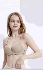 Detail view of skin-toned seamless bra featuring flexible wide side wings for pressure relief