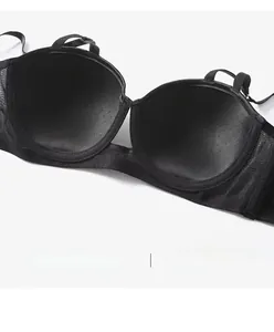 Detail of black seamless bra featuring breathable mesh fabric and integrated inner cup pads