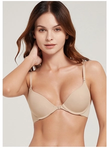 Front closure design on seamless beige bra with slender straps and smooth texture