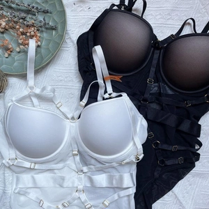 Lace bodysuit lingerie set in black and white with strappy details and push up cups