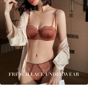 Detail of French lace embroidery and satin finish on dark brown lingerie set